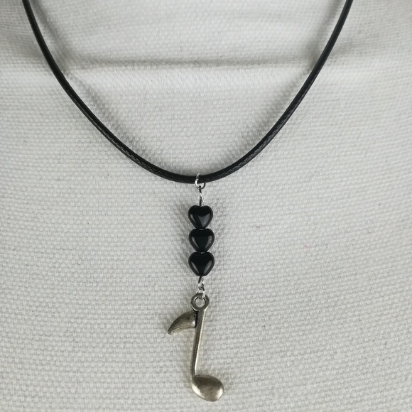 Jewelry - Music note necklace made with black heart beads